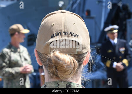 Kiel, Germany. 07th June, 2019. With 'Ready to Fight' printed on her cap, a US Navy female soldier stands at the start of the Baltic Operations (BALTOPS) manoeuvre in the naval port. Warships from 18 nations take part in the manoeuvre on the Baltic Sea starting on 08.06.2019 Credit: Carsten Rehder/dpa/Alamy Live News Stock Photo