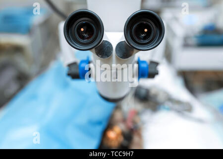 Operating microscope close-up. Sterile operating room in a veterinary clinic. Preparing for the operation of the dog. The ophthalmologist operates on  Stock Photo