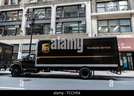 New York City, USA - July 31, 2018: UPS transportation company truck parked on a street of Manhattan with people around in New York City, USA Stock Photo