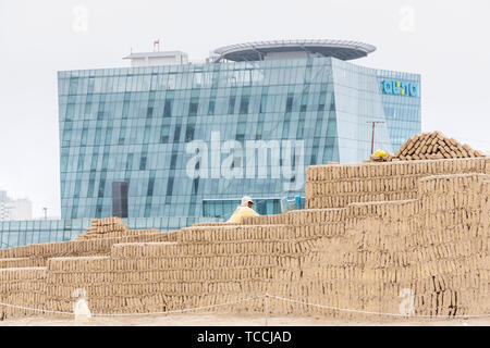 Archaeoligist at work at Huaca Pucllana, pre Columbian, pre Inca, pyramid temple, tomb and administrative center, frog shaped, adobe mound, and museum Stock Photo