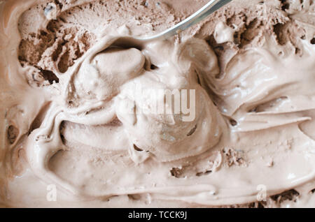 Texture of melting chocolate ice cream. Brown background, close up Stock Photo