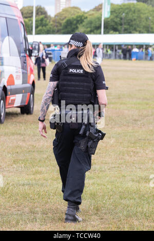 British armed police officers policing an outdoor event Stock Photo