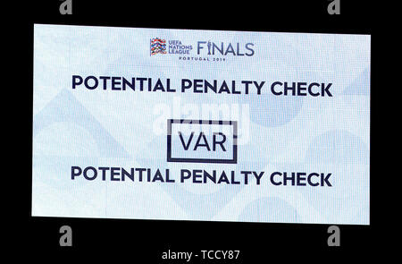The big screen displays a VAR potential penalty check resulting in no penalty for the Netherlands during the Nations League Semi Final at Estadio D. Alfonso Henriques, Guimaraes. Stock Photo