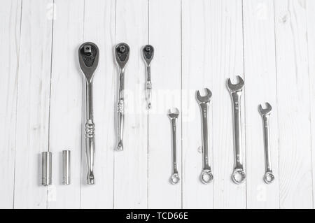 Tools, set wrenches on a white wooden background. Top view Stock Photo