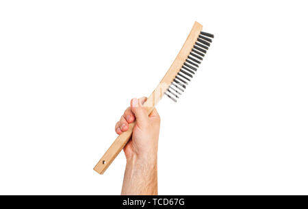 Tool. Hand is holding wire metal brush isolated on a white background . Stock Photo