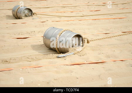 Sports competition with a barrel and a rope on the beach Stock Photo ...
