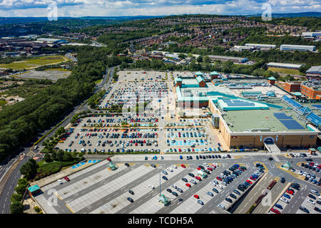 Aerial image of Meadowhall, one of the largest shopping malls in the UK. Taken in June 2019 during a hot day when the car park is nearly full. Stock Photo