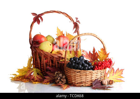 beautiful autumn harvest in baskets and leaves isolated on white Stock Photo