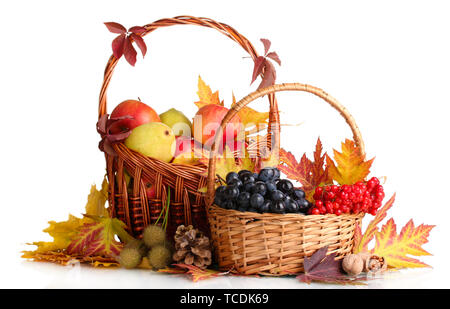 beautiful autumn harvest in baskets and leaves isolated on white Stock Photo