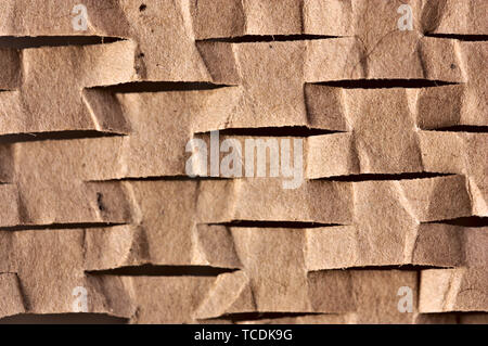 Close-up of a cardboard with small cuts that form a horizontal pattern Stock Photo