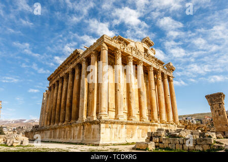 Ancient Roman temple of Bacchus with surrounding ruins and blue sky in the background, Bekaa Valley, Baalbek, Lebanon Stock Photo