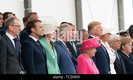 U.S President Donald Trump stands with European leaders during an event marking the 75th anniversary of D-Day June 5, 2019 in Portsmouth, England. Standing left to right are: Philip May, husband of British Prime Minister Theresa May, French President Emmanuel Macron, British Prime Minister Theresa May, Prince Charles, Queen Elizabeth II, U.S. President Donald Trump, First Lady Melania Trump, Greek President Prokopis Pavlopoulos and German Chancellor Angela Merkel. Stock Photo