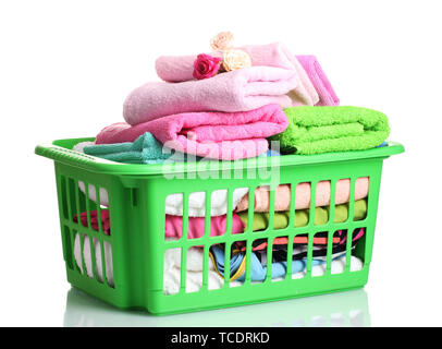 Towels in green plastic basket isolated on white Stock Photo