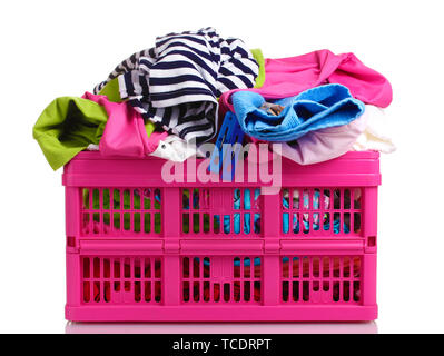 Clothes in pink plastic basket isolated on white Stock Photo