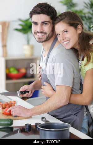 portrait of a cheerful young couple cooking together Stock Photo