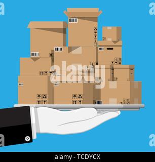 Pile cardboard boxes in tray in hand Stock Vector