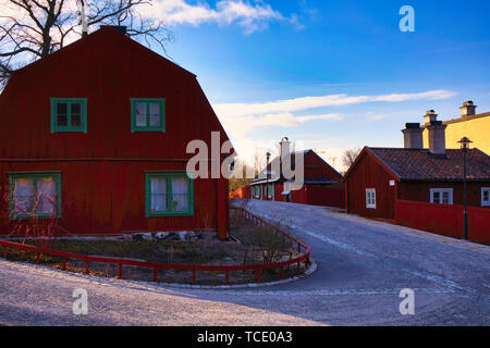 Typical wooden residential houses painted in traditional falun red in the cultural preserve of Vita Bergen (white mountain) Sodermalm Stockholm Sweden Stock Photo