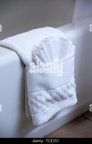 Folded, bath towel, wash cloth, bathtub, bathroom, decorative Stock Photo