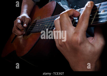 Close-up of a man playing the guitar Stock Photo