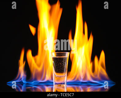 Flaming vodca on black background Stock Photo