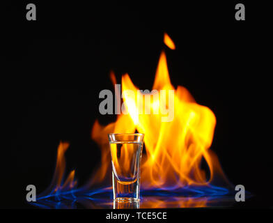 Flaming vodca on black background Stock Photo