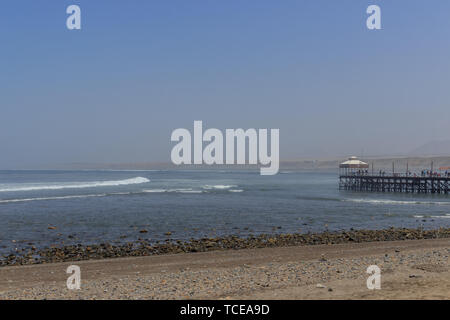 surfing beach with pier in huanchaco, peru Stock Photo