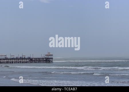 surfing beach with pier in huanchaco, peru Stock Photo