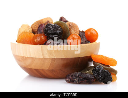 Dried fruits in wooden bowl isolated on white Stock Photo