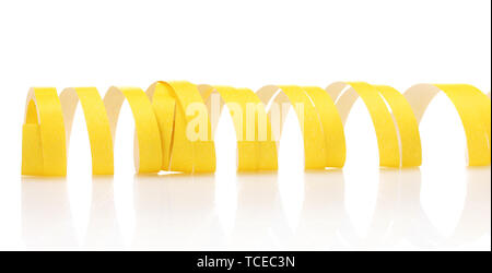 yellow streamer isolated on white Stock Photo - Alamy