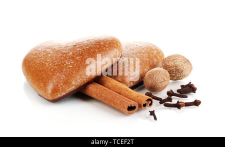 Heart-shaped cookies with cinnamon, nutmegs and carnation isolated on white Stock Photo