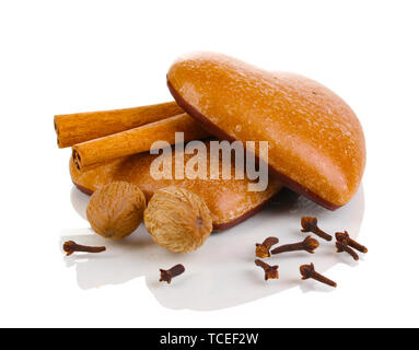 Heart-shaped cookies with cinnamon, nutmegs and carnation isolated on white Stock Photo