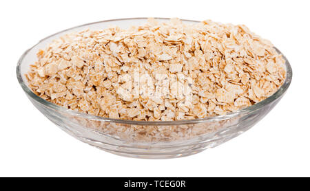 Oat flakes in oval glass bowl. Concept of healthy food. Isolated over white background Stock Photo