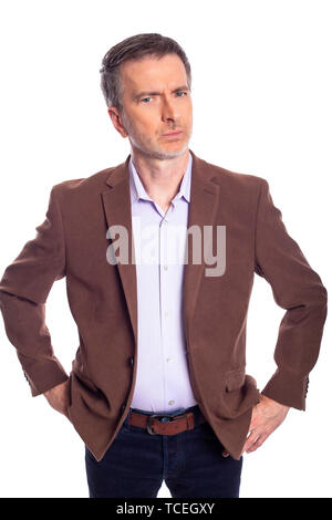 Middle aged bearded businessman on a white background wearing a brown jacket.  The mature man looks like an angry business executive. Stock Photo