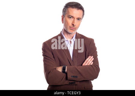 Middle aged bearded businessman on a white background wearing a brown jacket.  The mature man looks like a confident or arrogant business executive. Stock Photo