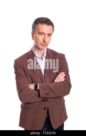 Middle aged bearded businessman on a white background wearing a brown jacket.  The mature man looks like a confident or arrogant business executive. Stock Photo