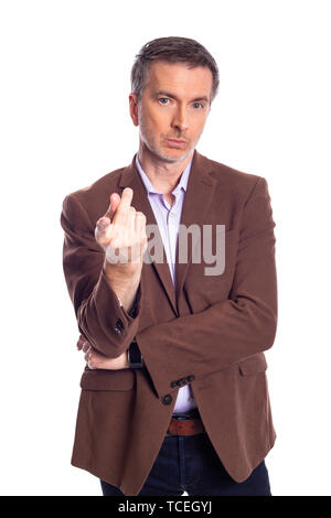 Middle aged bearded businessman on a white background wearing a brown jacket.  The mature man looks like a business executive pointing forward. Stock Photo