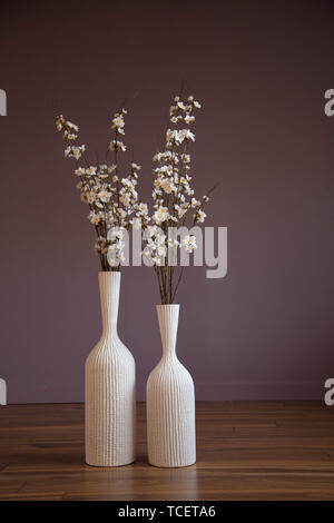 Vases apple tree  branches white flowers purple background  Stock Photo