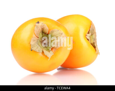 Two appetizing persimmons isolated on white Stock Photo