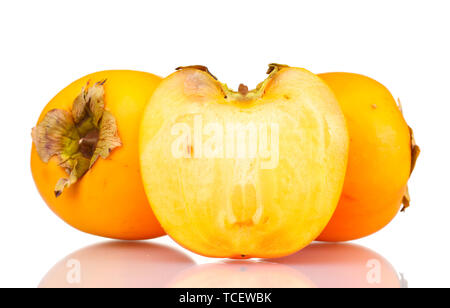 Two and half appetizing persimmons isolated on white Stock Photo