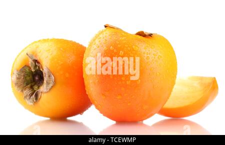 Appetizing persimmons with droplets isolated on white Stock Photo