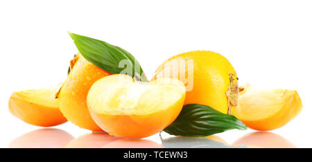 Appetizing persimmons with droplets and leaves isolated on white Stock Photo