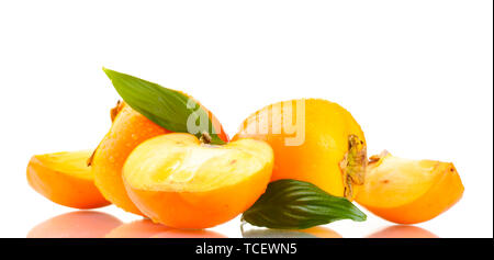 Appetizing persimmons with droplets and leaves isolated on white Stock Photo