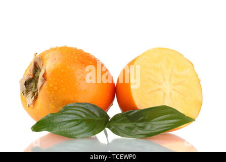 Appetizing persimmons with droplets and leaf isolated on white Stock Photo