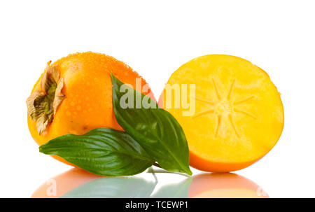 Appetizing persimmons with droplets and leaf isolated on white Stock Photo