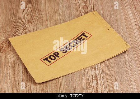 Envelope with top secret stamp on wooden background Stock Photo