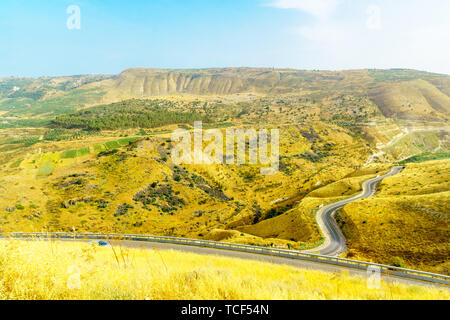 Landscape of the Golan Heights, winding road 98, and the Yarmouk River valley, near the border between Israel and Jordan Stock Photo