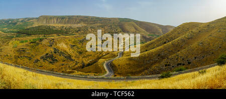 Panoramic landscape of the Golan Heights, winding road 98, and the Yarmouk River valley, near the border between Israel and Jordan Stock Photo