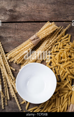 Composition of raw pasta uncooked tricolore fusilli, pasta twist shape ...