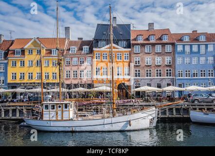 Sailing boats on the canal in front of colorful facades, Nyhavn, Copenhagen, Denmark, Europe Stock Photo
