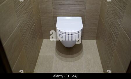 Mounted toilet bowl. Closed Toilet in the toilet Stock Photo